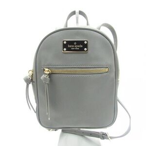 Kate Spade New York Mini Bradley nylon backpack in gray with gold zippers